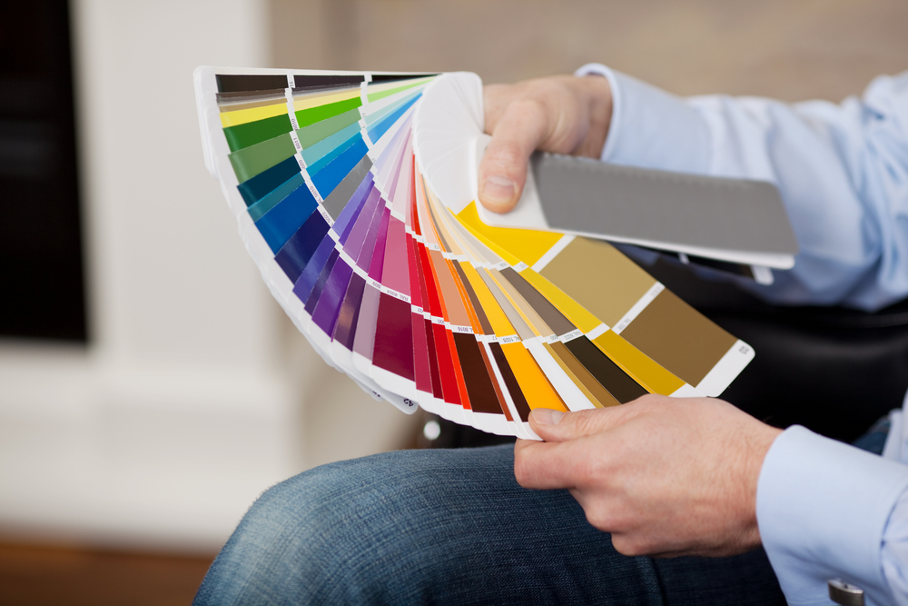 hand hold paint color swatches