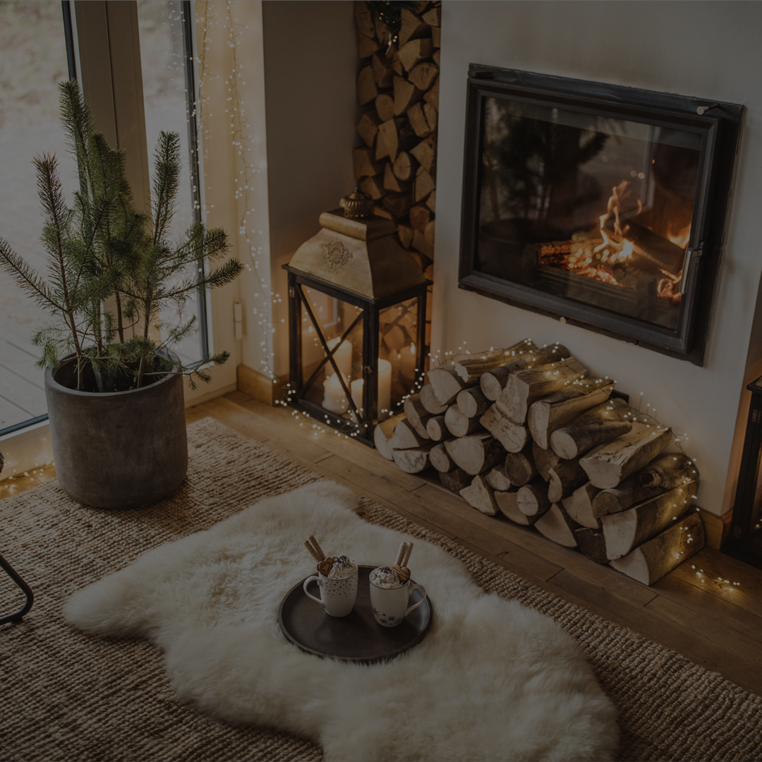 Cozy living room with lit fireplace